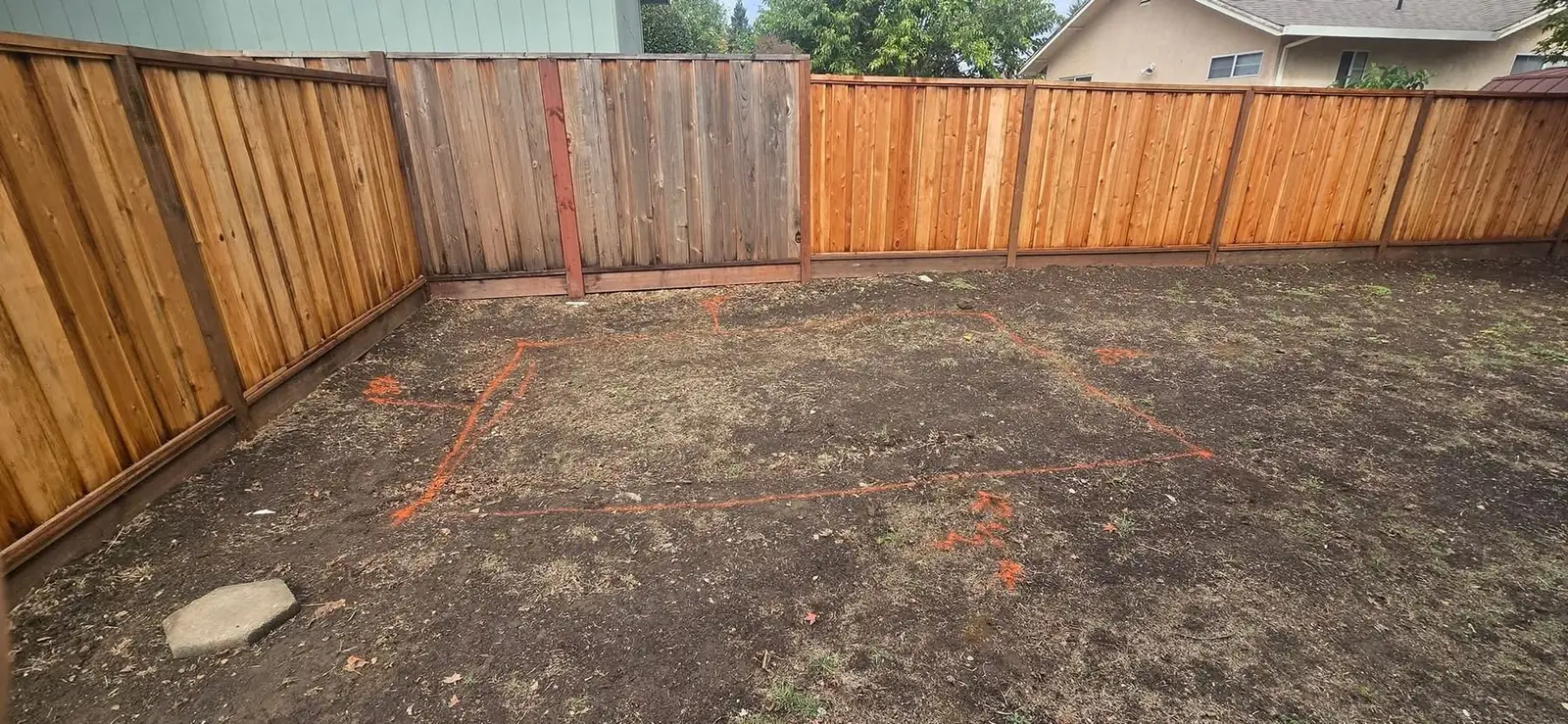 Backyard staged and marked before hardscape installation