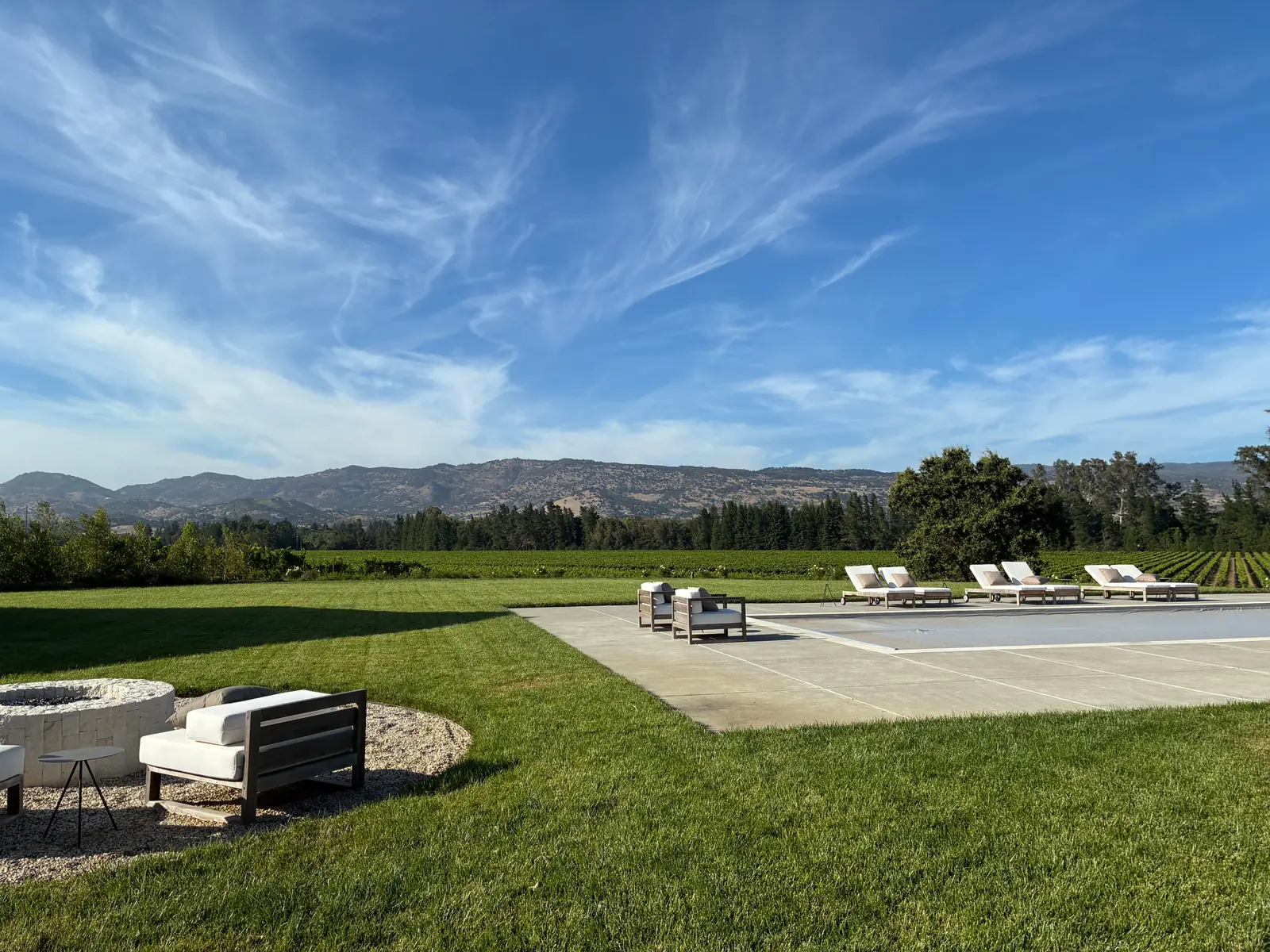Manicured lawn and outdoor living space with valley views